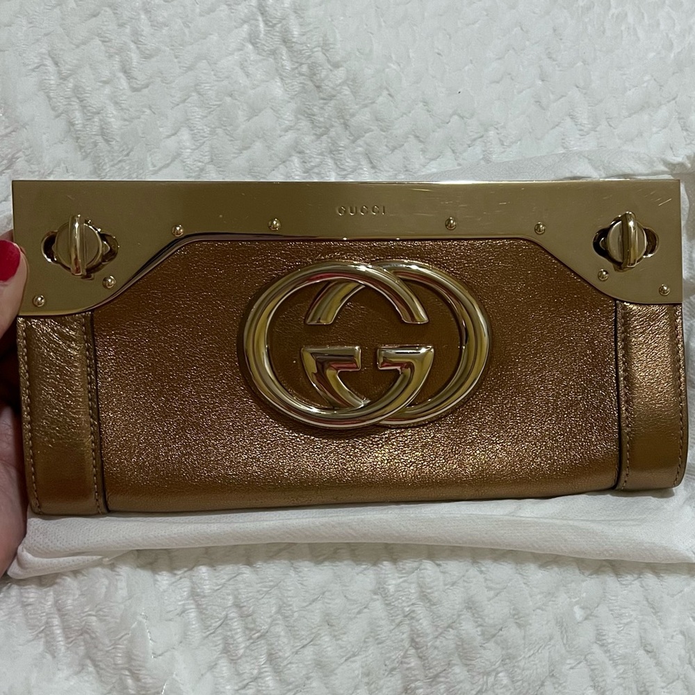 Gucci Gold Leather Starlight Interlocking GG Clutch (listing price firm)